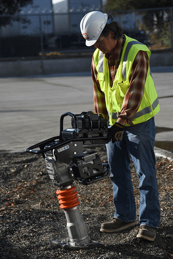 Worker operating battery rammer