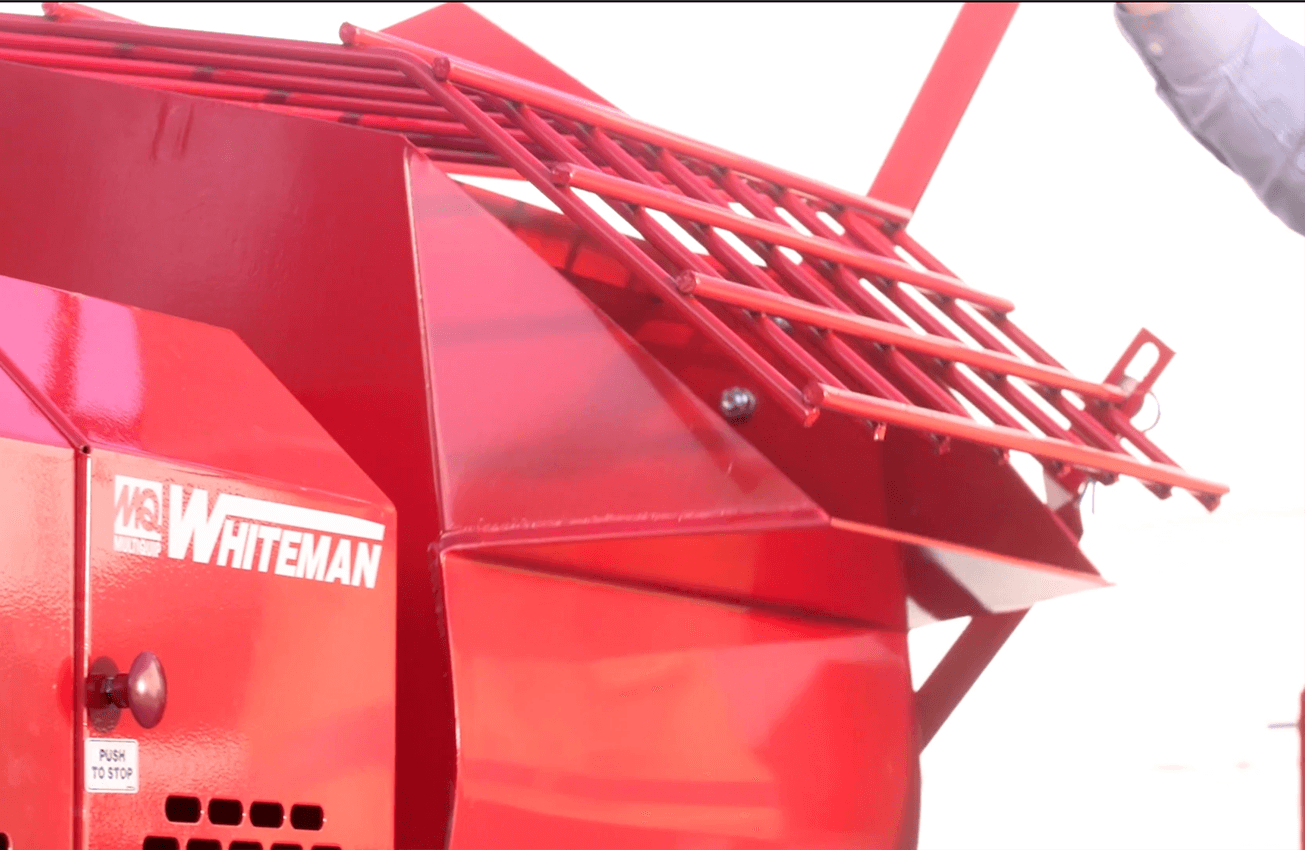 Grate-covered opening on mixer