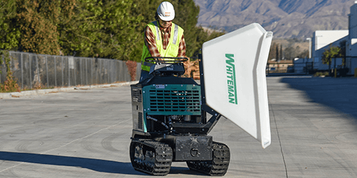 Photo of worker driving track buggy