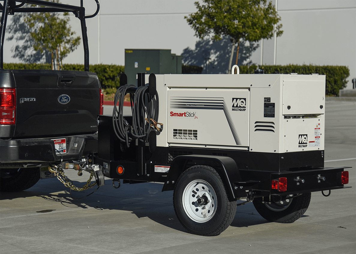 Photo of welder hitched to pickup truck